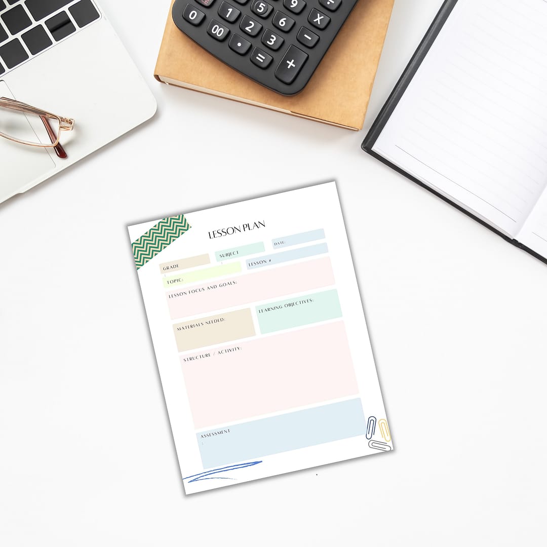 Flat lay of the Printable Planner for Teachers on a desk, accompanied by a notebook, glasses, and a calculator—ideal for printables and organized planning.